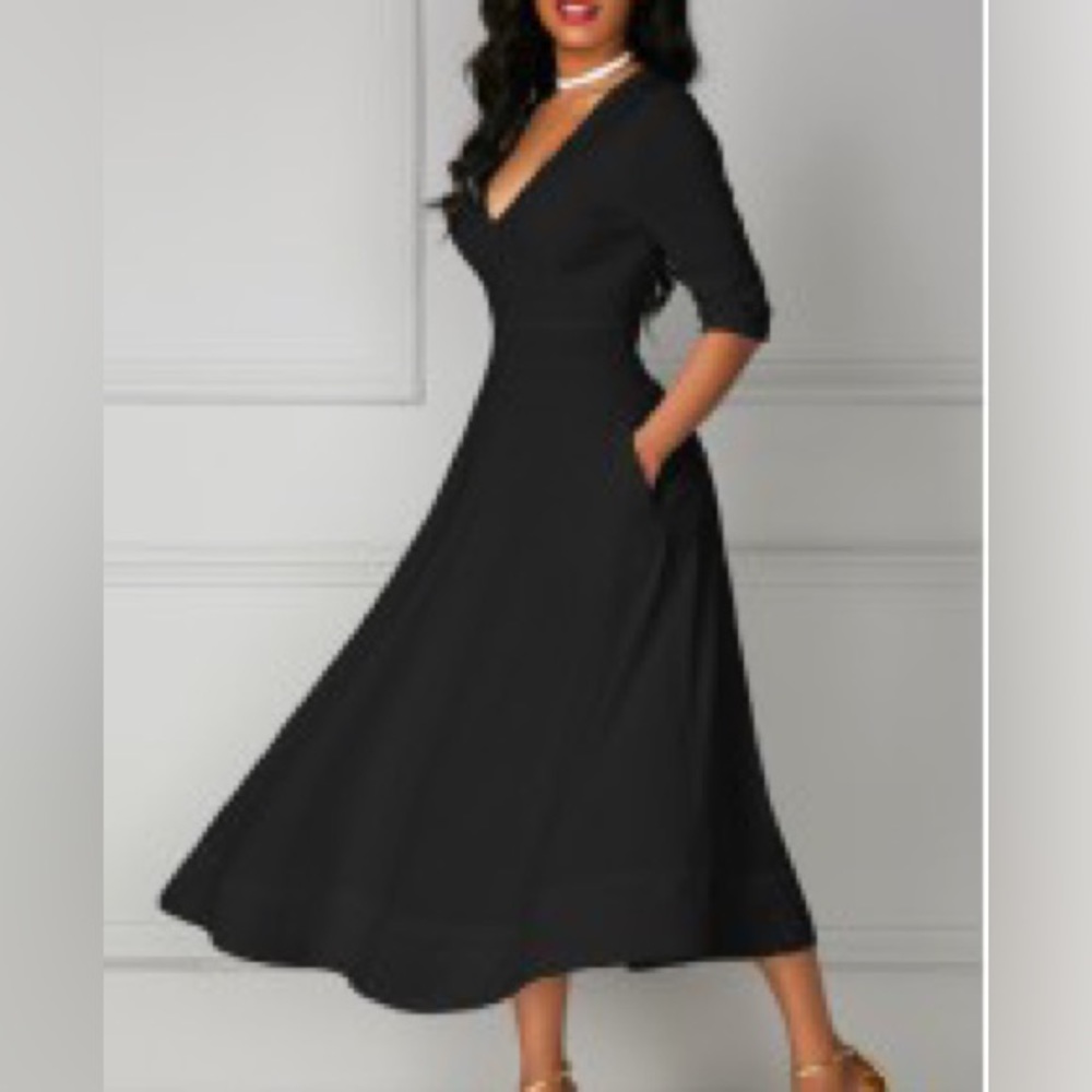 V Neck black dress with pockets it’s perfect new never worn size XXL 3/4 sleeves